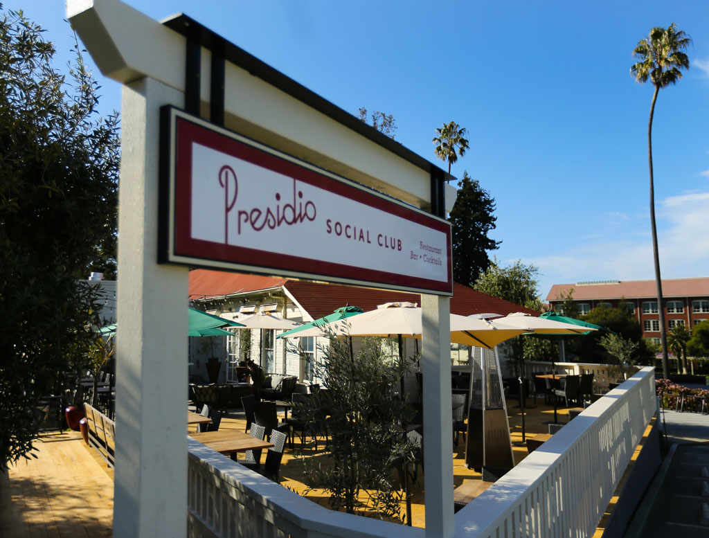 Presidio Social Club signage at outdoor dining area