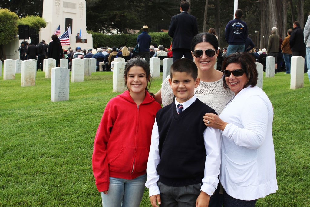 A couple women with two children in middle of SF National Cemetery