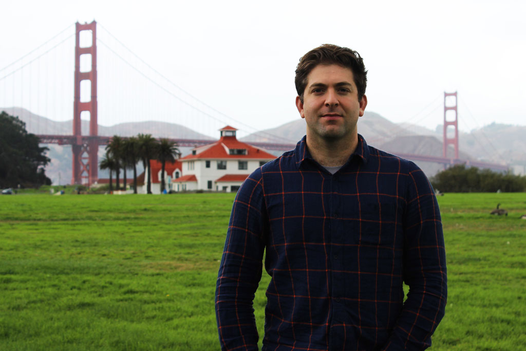 Co-founder and CEO Justin Catalano standing at Crissy Field with the Golden Gate Bridge in the background.