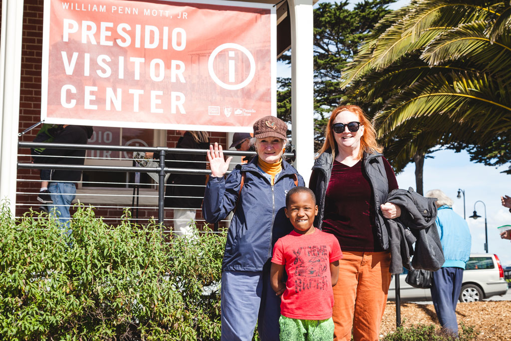 A couple women and child in front of Presidio Visitor Center