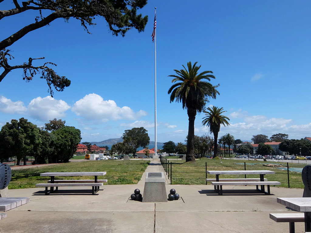 Picnic tables, NHL plaque, and flag in Main Post