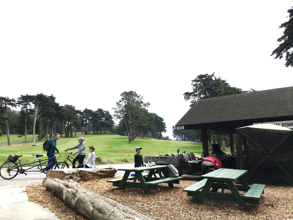 Visitors at picnic tables at General Store at Presidio Golf Course