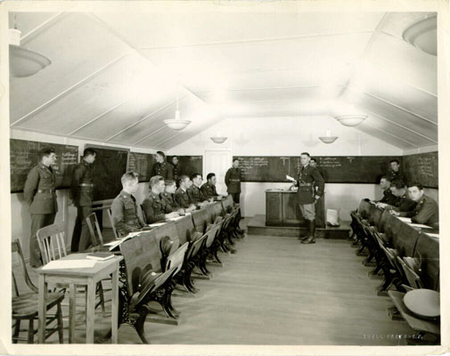 Instructor and young men being trained in a classroom