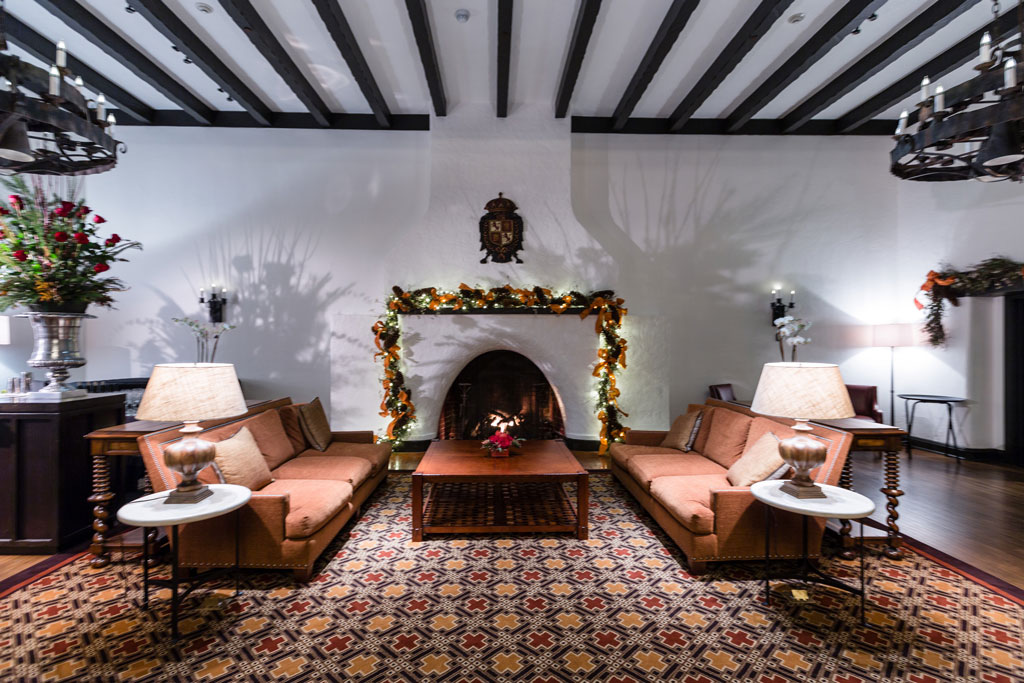 Fireplace in Moraga Hall lounge area decorated with garland