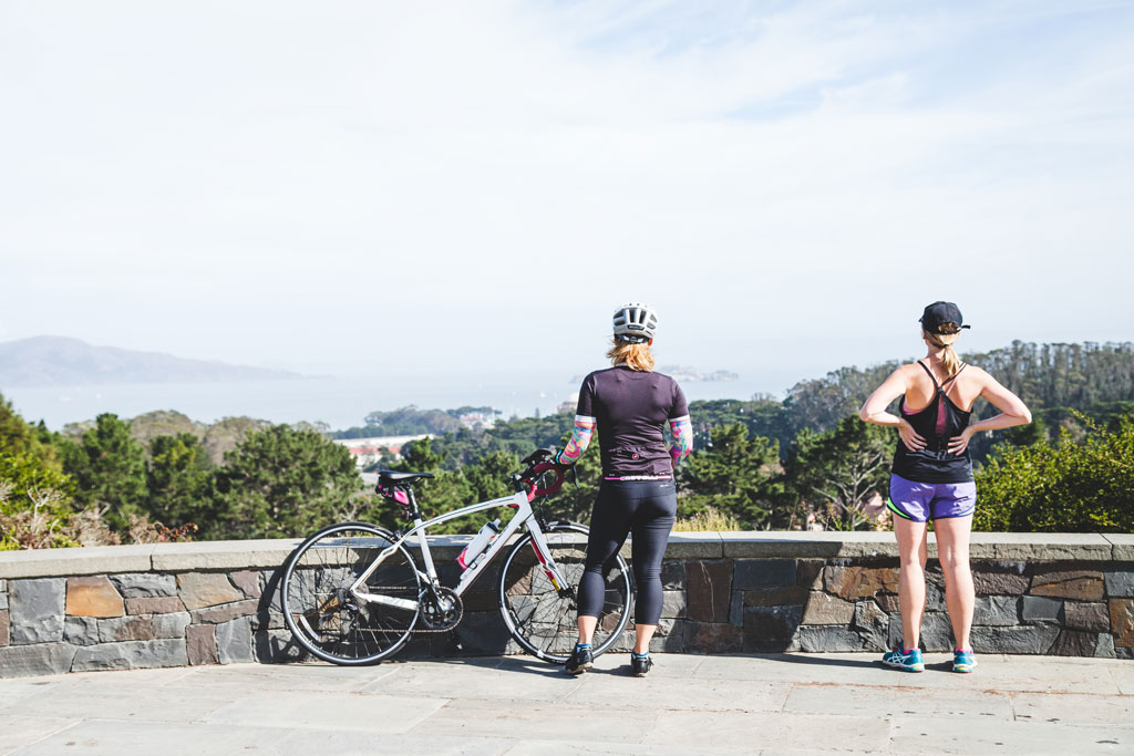 A bicyclist and runner looks outward at Inspiration Point Overlook