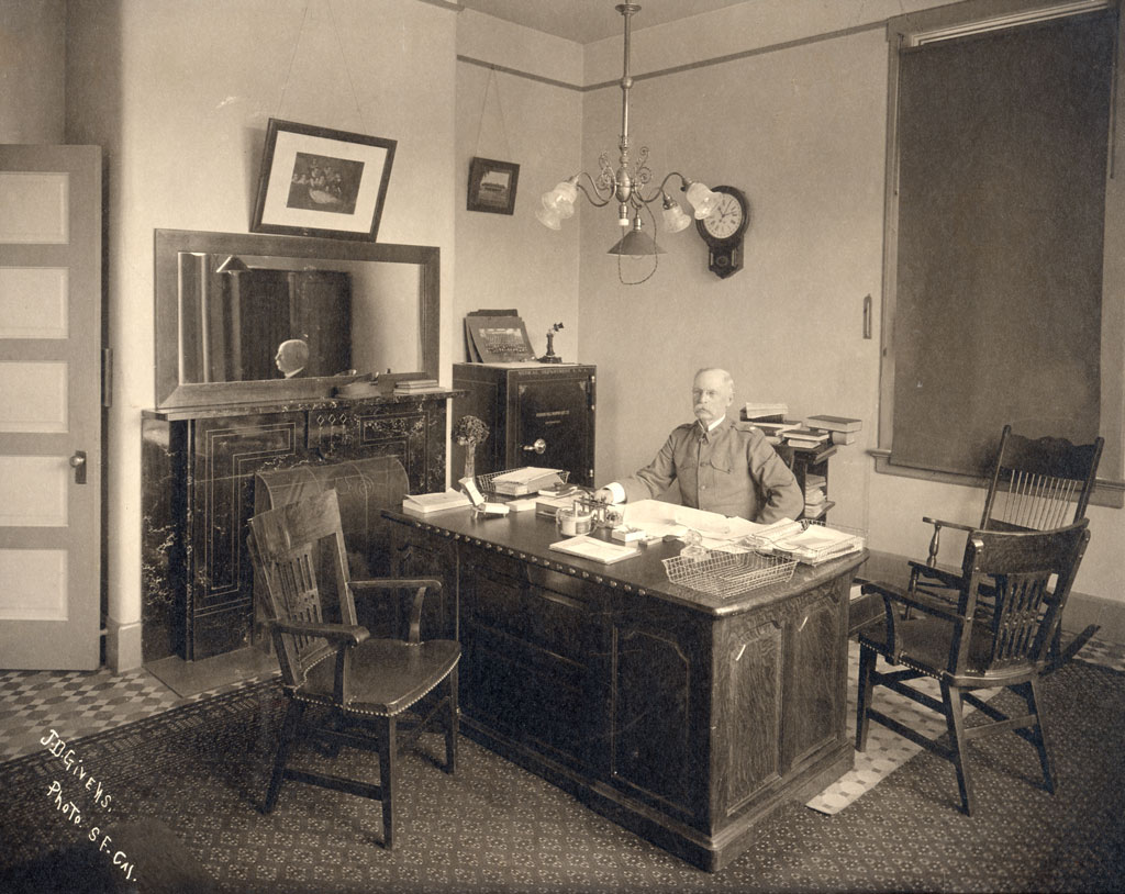 Lt. Col. George H. Torney at his desk in the hospital.