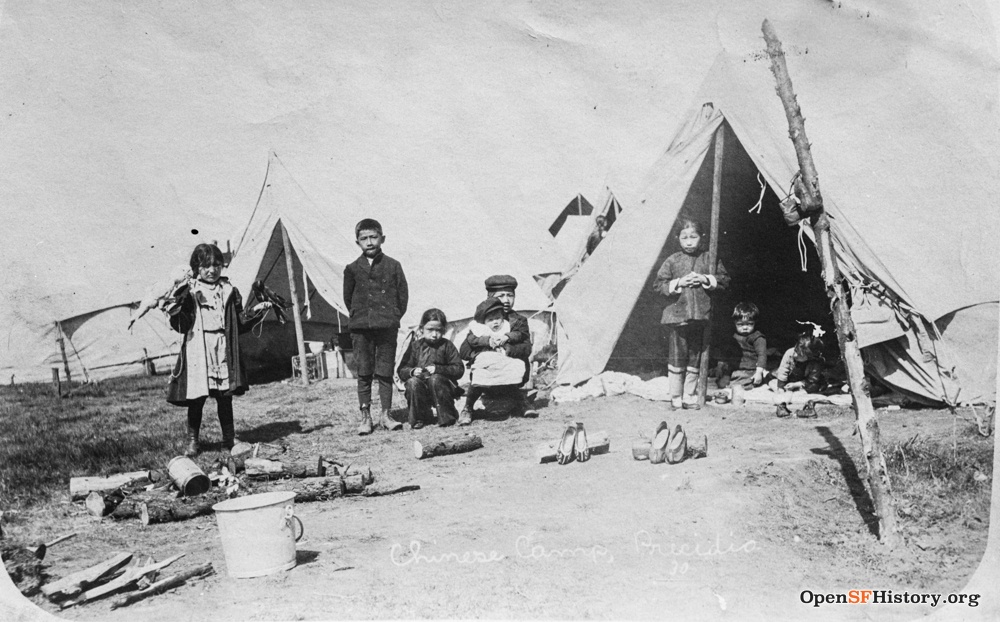Children at the Chinese refugee camp in front of tents