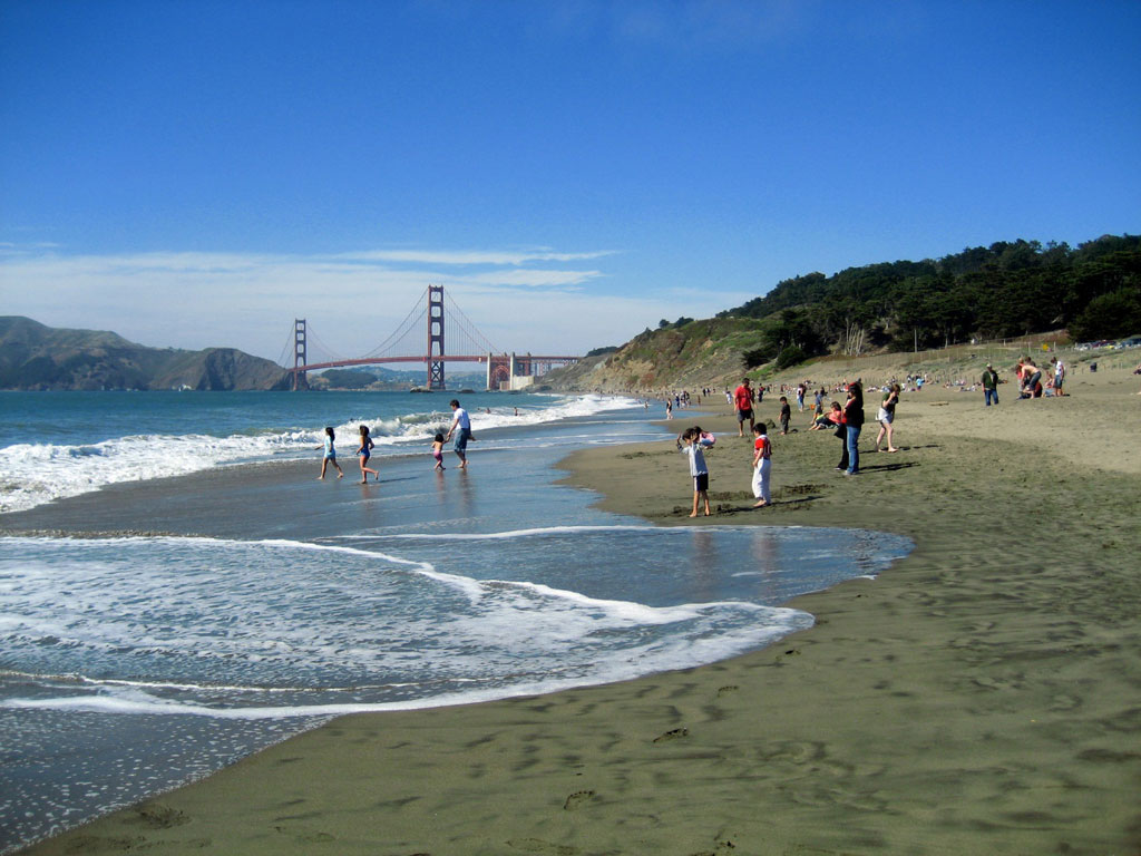 Visitors at Baker Beach on a sunny day