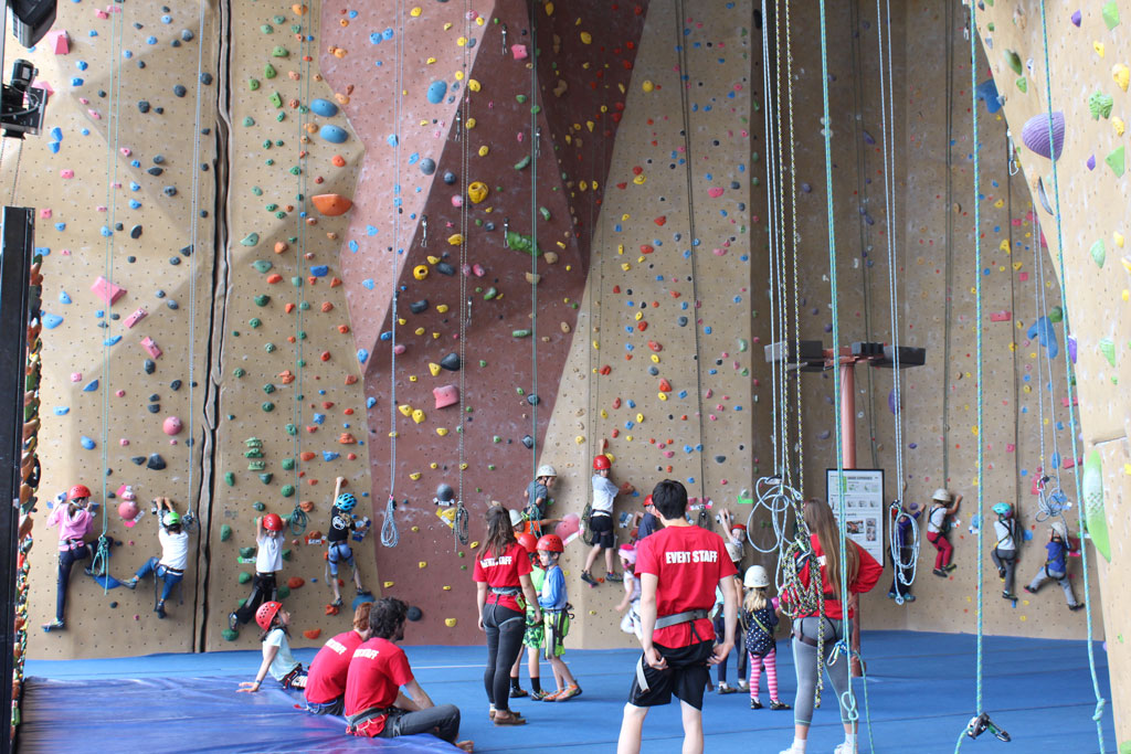 Children and adults indoor rock climbing