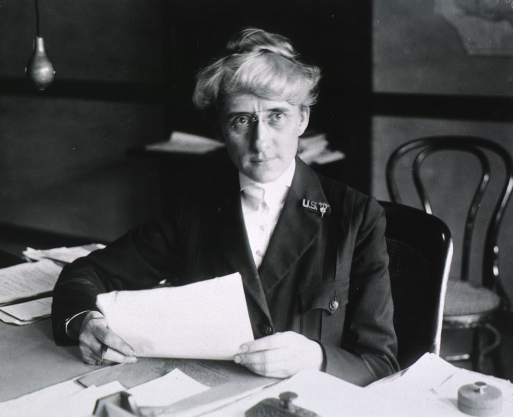 Portrait of Superintendent Dora E. Thompson at desk. Image courtesy of the National Library of Medicine.