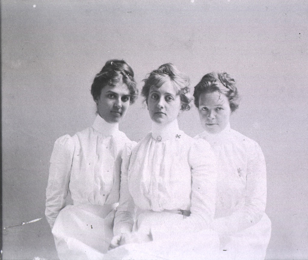 Three female nurses in white