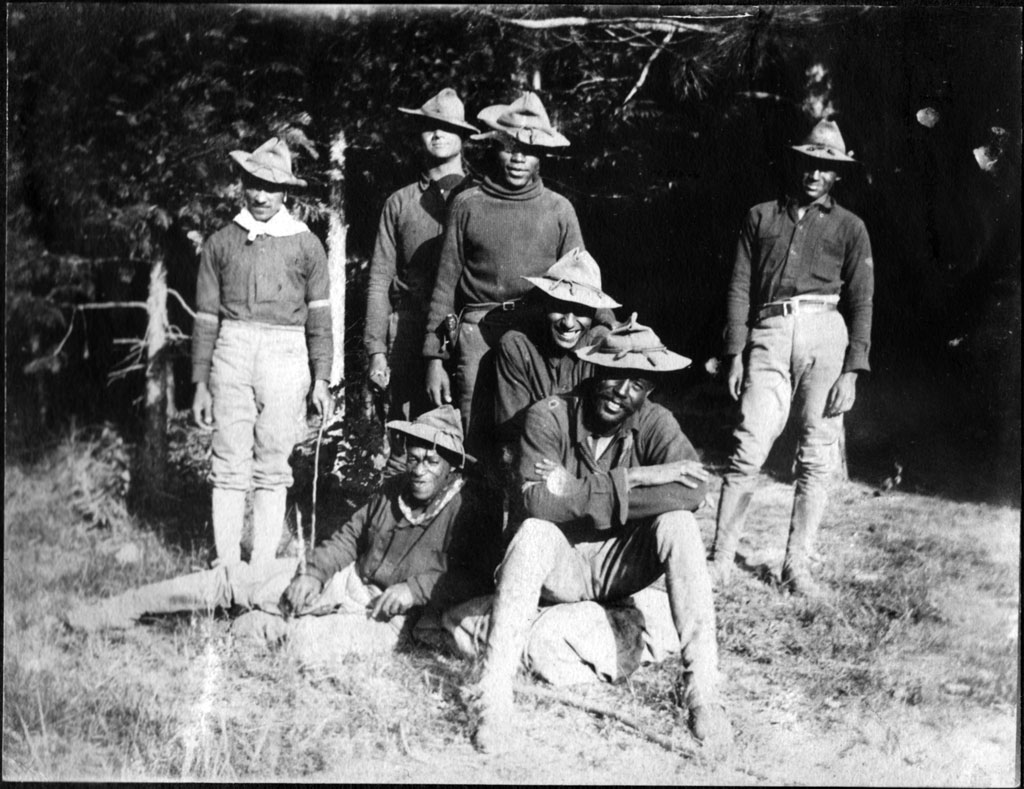 Group photo of seven Buffalo Soldiers at park