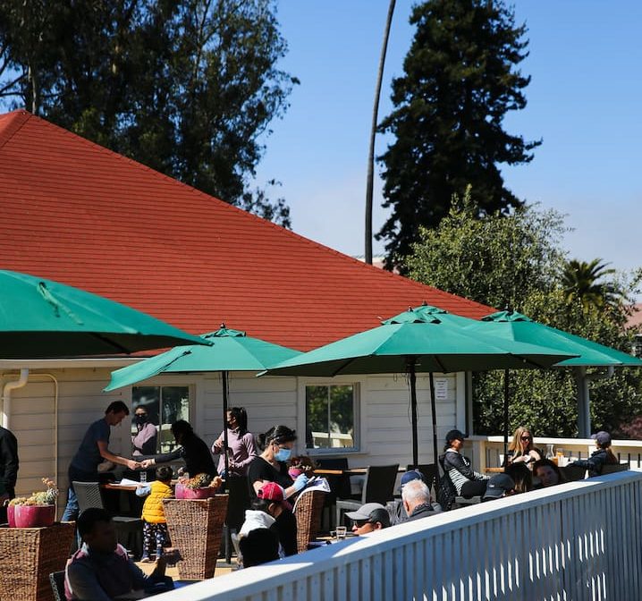 Guests dining on the outdoor patio at Presidio Social Club.