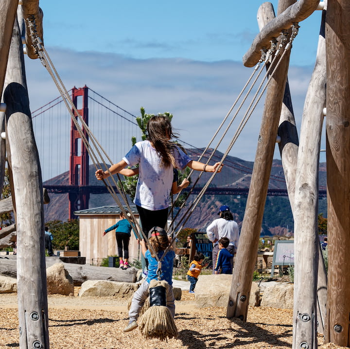 Kids play on swings at the OutposT. Photo by Dan Friedman.