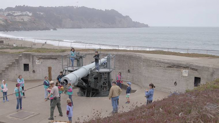 Visitors gathered around Battery Chamberlin.