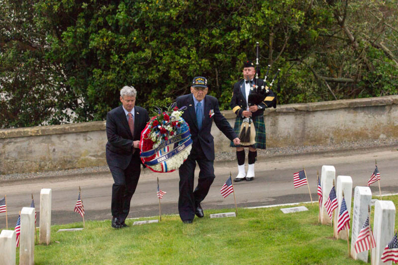 Wallace Levine at the San Francisco National Cemetery with a wreath.