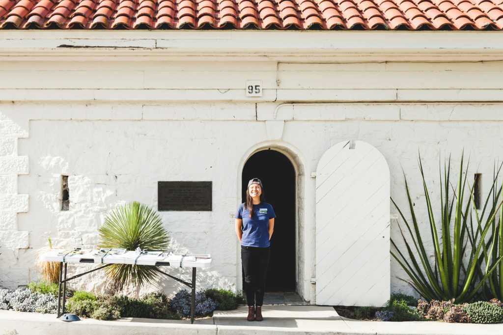 Maivy Xuan Nguyen, intern, in the doorway leading to Tree Fall.