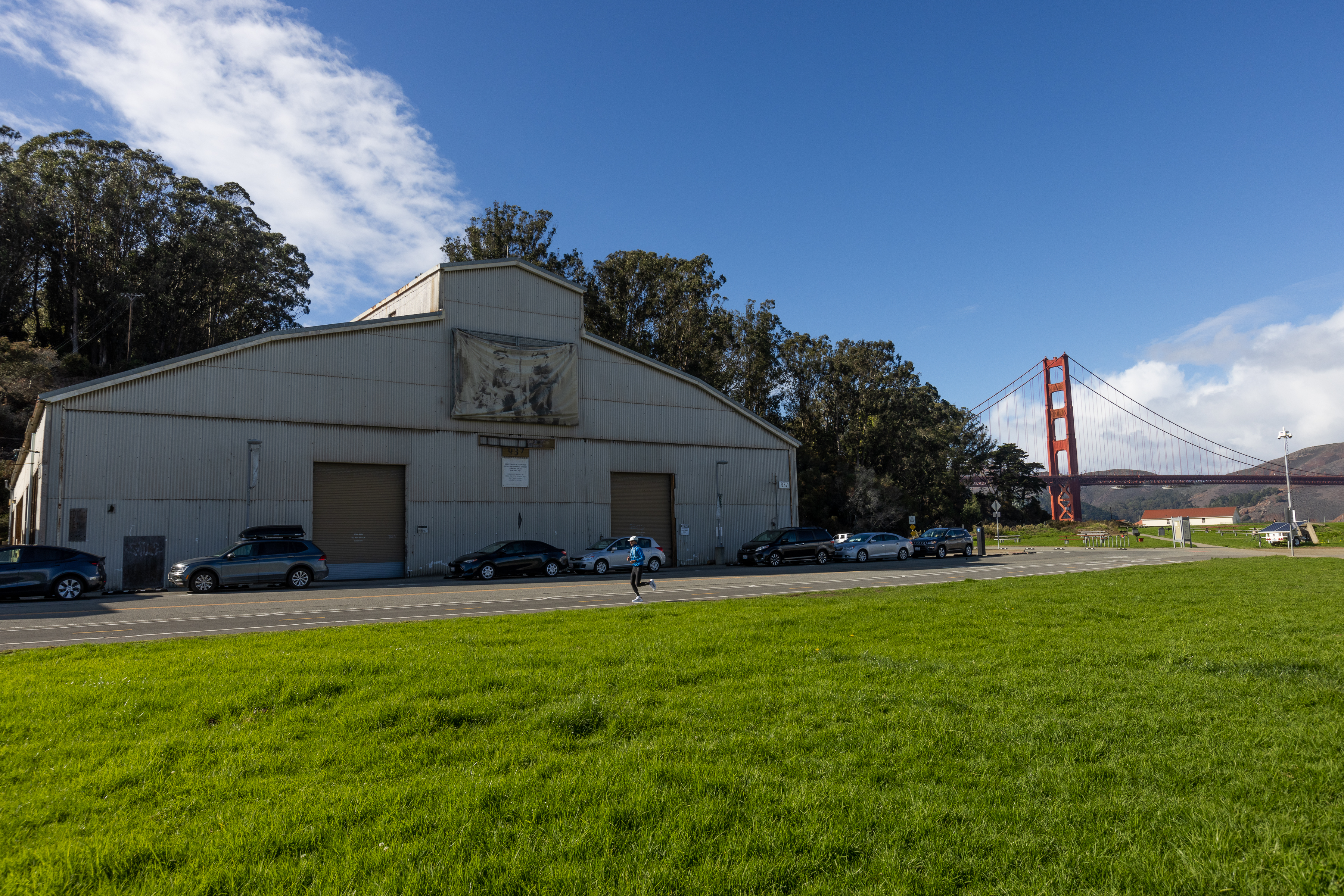 Airport hangars on Mason street with the golden gate bridge in the background.