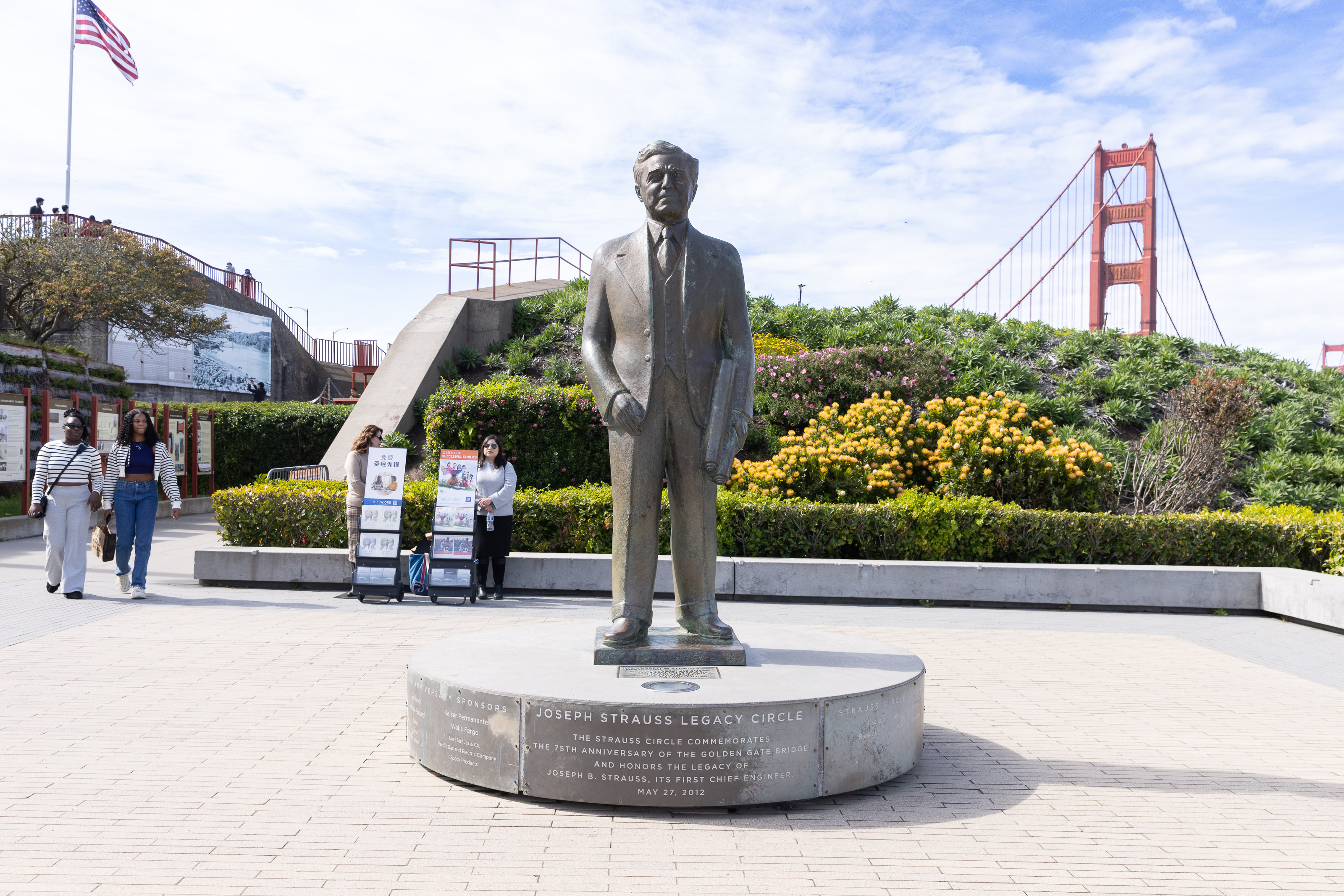 Statue of Joseph Strauss Legacy Circle at the Golden Gate Bridge Welcome Center and the Golden Gate Bridge in the background