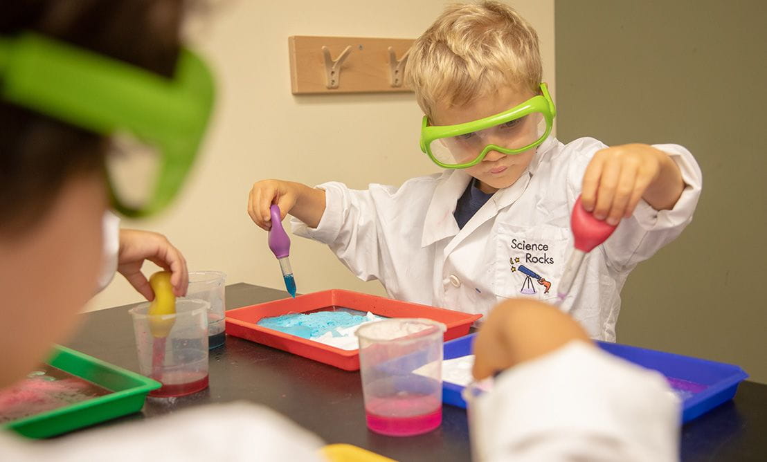 toddler experimenting in classoom