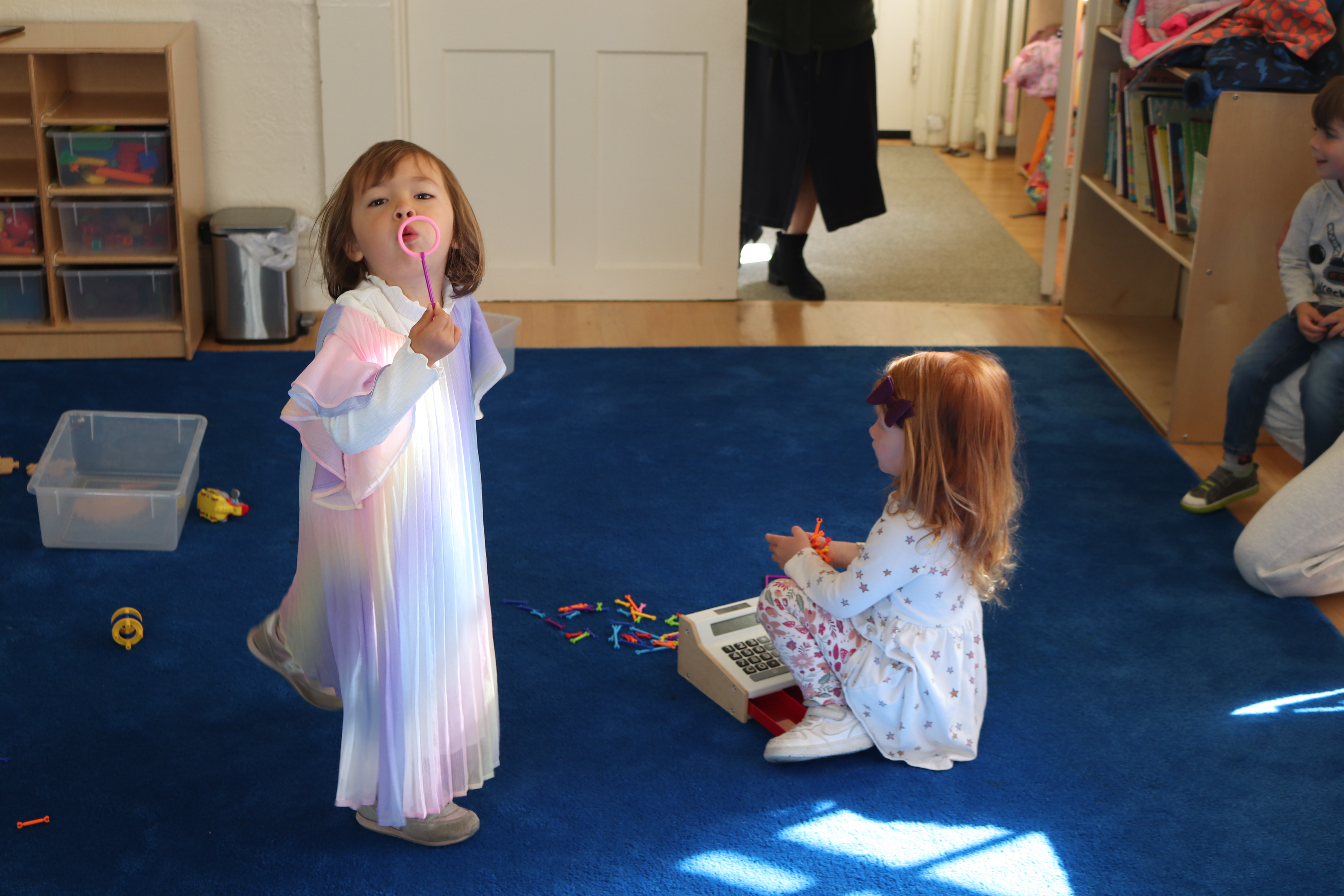 Two little girls playing at Little Bee School