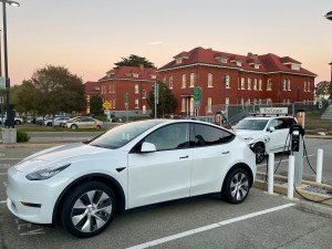Car parked at an EV station in the Presidio.